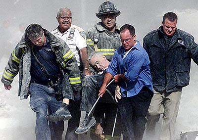 First responders carrying Father Mychal Judge from the dust of Ground Zero on September 11, 2001